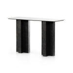 Featuring Terrell Console Table - Raw Black by Four Hands at Amethyst Home. Finished in a raw black, uniquely angular cast aluminum legs, this Terrell Console Table - Raw Black showcases a rectangular tabletop of solid marble in a clean, polished white. We'd love to see this in an entryway or behind a sofa. 
Overall Dimensions: 51"W x 17"L x 31.25"H
Colors: .  Amethyst Home provides interior design, new home construction design consulting, vintage area rugs, and lighting in the Seattle metro area.