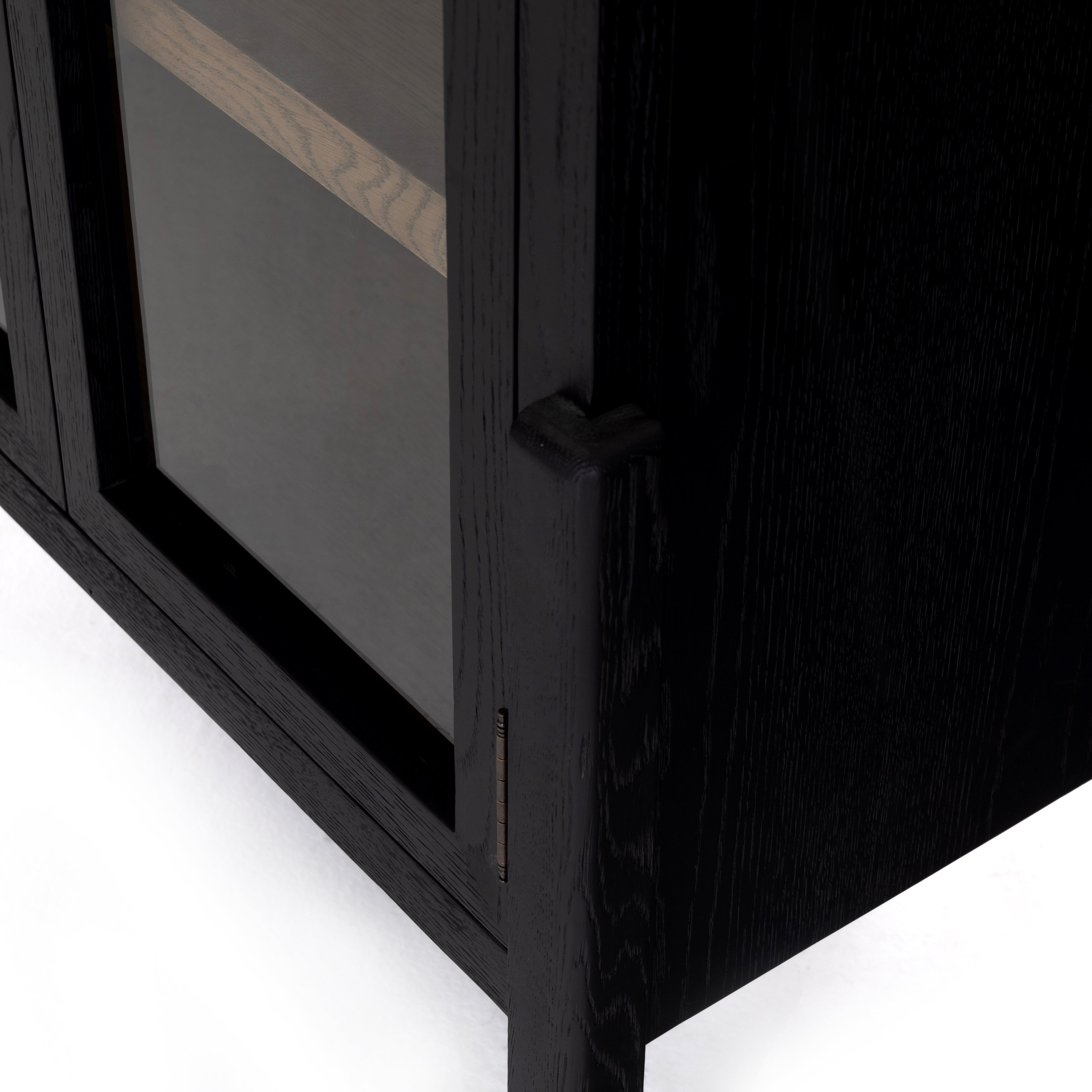 Featuring Tolle Cabinet - Drifted Matte Black by Four Hands at Amethyst Home. The original and signature two tone solid oak cabinet! Carefully crafted on stiletto legs, our clients enjoy its stunning wood grain look.
Overall Dimensions: 38"W x 19"L x 84"HColors: Antique Brass, Drifted Black, Drifted Oak SolidMaterials: Iron, Solid OakWeight: 185.3 lbVolume: .  Amethyst Home provides interior design, new home construction design consulting, vintage area rugs, and lighting in the Seattle metro area.