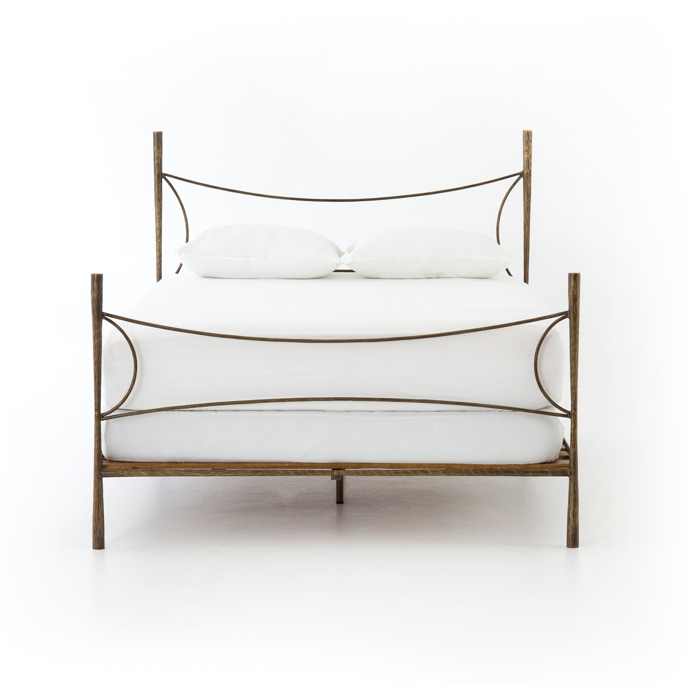 Featuring Westwood Bed by Four Hands at Amethyst Home. Beguiling curves soften hard materials for marked drama with this Westwood Bed. Slim, hammered iron is finished in antique brass for depth that defies this frame's feminine air. Low-profile box spring recommended.
Colors: Antique BrassMaterials: Iron
Queen Overall Dimensions:  62.00"w x 84.00"d x 51.00.  Amethyst Home provides interior design, new home construction design consulting, vintage area rugs, and lighting in the Park City metro area.