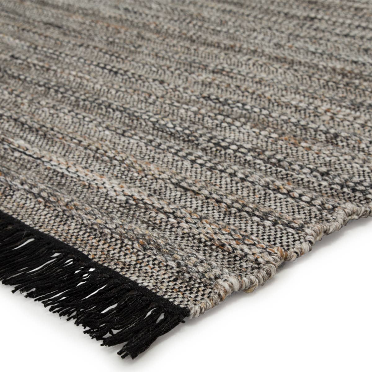 Featuring Castillo Torre Rug - Jet Black by Jaipur Living at Amethyst Home. The handwoven Castillo Torre Area Rug - Jet Black features a soft feel and relaxed, versatile style. The Torre area rug showcases a rich blend of black, gray, and rust tan tones for a grounding, neutral look. Crafted of PET yarn, or recycled plastic, this durable and textured rug br.  Amethyst Home provides interior design, new home construction design consulting, vintage area rugs, and lighting in the Monterey metro area.