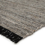 Featuring Castillo Torre Rug - Jet Black by Jaipur Living at Amethyst Home. The handwoven Castillo Torre Area Rug - Jet Black features a soft feel and relaxed, versatile style. The Torre area rug showcases a rich blend of black, gray, and rust tan tones for a grounding, neutral look. Crafted of PET yarn, or recycled plastic, this durable and textured rug br.  Amethyst Home provides interior design, new home construction design consulting, vintage area rugs, and lighting in the Monterey metro area.