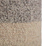 Featuring Folke Micco Volcanic Pouf by Jaipur Living at Amethyst Home. Cozy and stylish in the same moment, the Folke Micco Volcanic Pouf boasts the soft and inviting texture of the on-trend shearling look. Crafted of wool, the cylinder Micco pouf showcases boucle details and a color-blocked design. The heathered gray and cream colorway offers a perfectly n.  Amethyst Home provides interior design, new home construction design consulting, vintage area rugs, and lighting in the Monterey metro area.