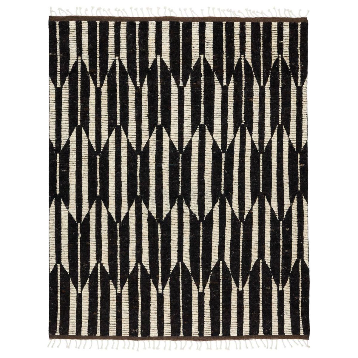 Featuring Keoka Quest Mole Hand-Knotted Rug by Jaipur Living at Amethyst Home. The Keoka Quest Mole Area Rug boasts a fresh take on classic Afghani hand-knotted textiles. In rich, grounding tones of deep brown and ivory, the stylish contrast of the Quest rug anchors room with bold yet neutral appeal. The texture-rich wool pile features a ribbed construct.  Amethyst Home provides interior design, new home construction design consulting, vintage area rugs, and lighting in the Los Angeles metro area.