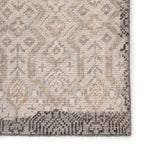 Featuring Revolution Prospect Hand-Knotted Rug by Jaipur Living at Amethyst Home. The Revolution collection is inspired by traditional style and beautifully detailed antique textile designs. The hand-knotted Prospect area rug showcases a captivating geometric design in muted tones of gray and gold. A charcoal edge creates a unique border effect around this.  Amethyst Home provides interior design, new home construction design consulting, vintage area rugs, and lighting in the San Diego metro area.