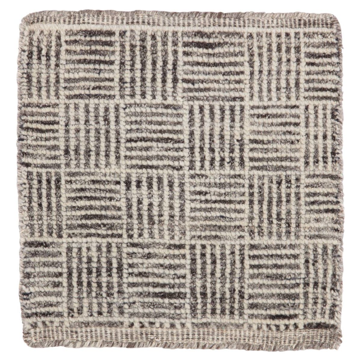 Featuring Rize Mugler Hand-Knotted Rug by Jaipur Living at Amethyst Home. The Rize Mugler Area Rug offers intricate and delicately designed global patterns to the modern home. A thatched square motif creates an eye-catching geometric design on the artistically distressed Mugler area rug. In an earthy ivory and black colorway, this durable hand-knotted wool acc.  Amethyst Home provides interior design, new home construction design consulting, vintage area rugs, and lighting in the Omaha metro area.