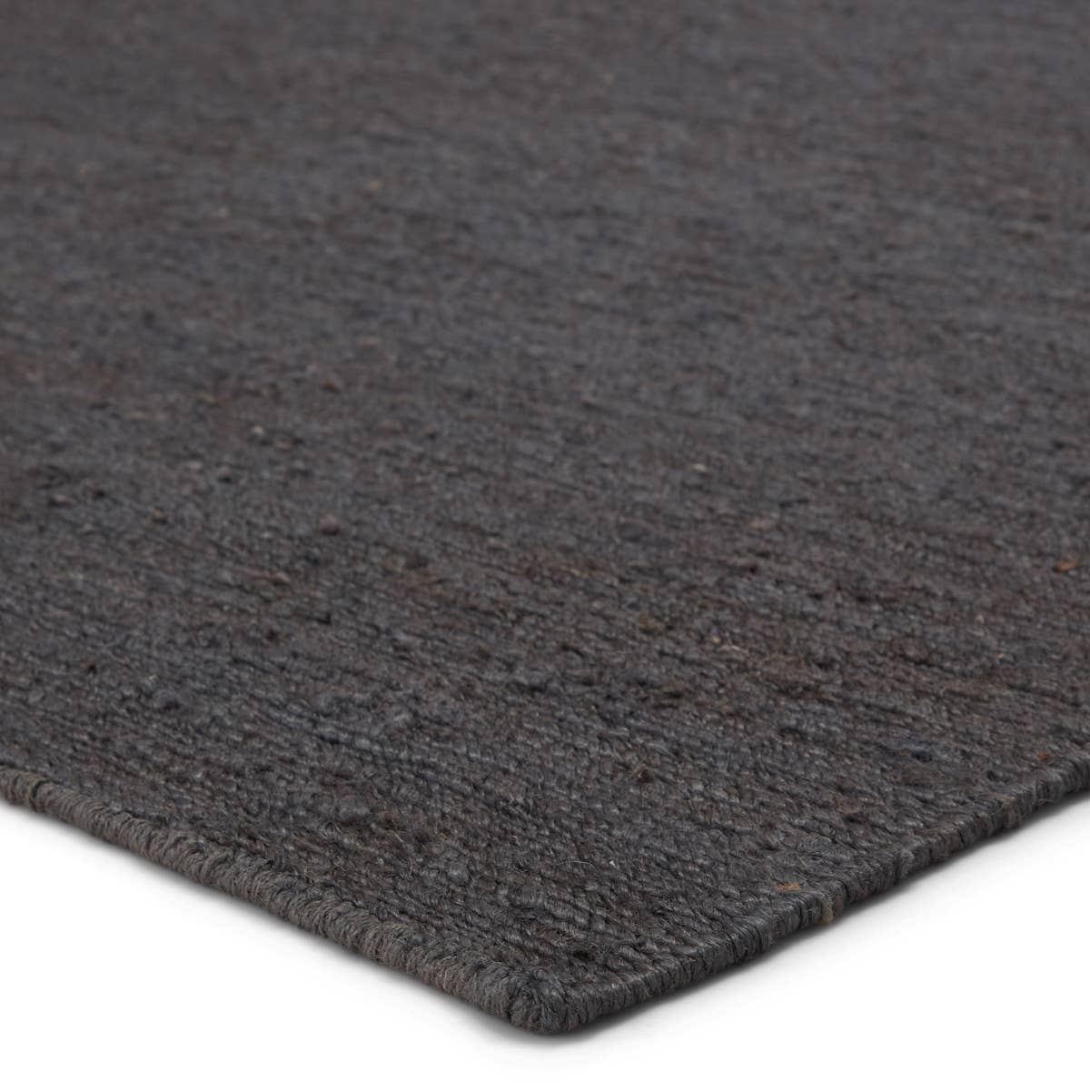 Featuring Sabine Linden Darkshadow/Ebony Rug by Jaipur Living at Amethyst Home. The Sabine collection lends rich texture and organic allure to modern homes. The Linden area rug features a fine, single-line Sumak knotting technique for an exquisite feel and craftsmanship. This rich, black natural area rug is the perfect accent for sophisticated spaces in want .  Amethyst Home provides interior design, new home construction design consulting, vintage area rugs, and lighting in the Austin metro area.