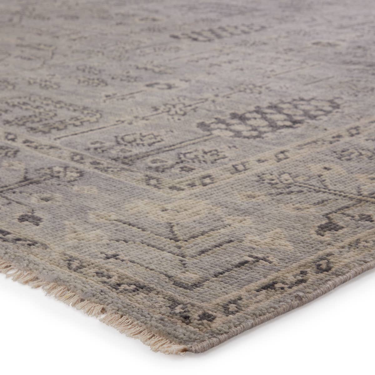 Featuring Salinas Ginerva Hand-Knotted Rug by Jaipur Living at Amethyst Home. The Salinas collection is punctuated by traditional, intricate details and a soft, hand-knotted wool construction. The neutral Ginerva area rug makes a transitional statement with tonal gray hues and vintage motifs. This durable, artisan-made area rug boasts a distressed look for .  Amethyst Home provides interior design, new home construction design consulting, vintage area rugs, and lighting in the Monterey metro area.