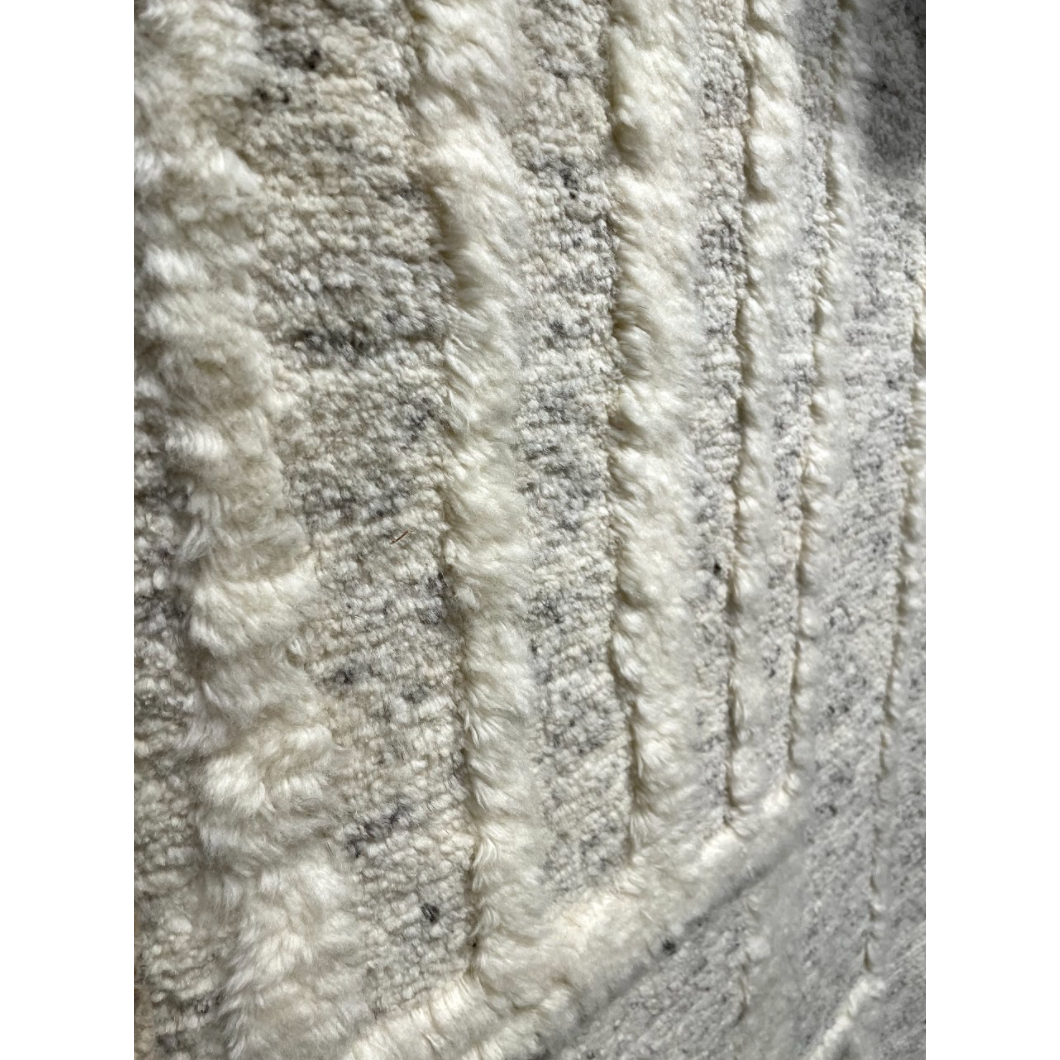 Featuring Tala Casamir Hand-Knotted Rug by Jaipur Living at Amethyst Home. The Tala Casamir Area Rug is a hand-knotted rug that brings a new sense of luxury and comfort to the contemporary home. The plush Casamir area rug makes a modern Moroccan statement, showcasing a crosshatched lattice design in an inviting cream hue with earthy toned flecks of brown wool .  Amethyst Home provides interior design, new home construction design consulting, vintage area rugs, and lighting in the Omaha metro area.