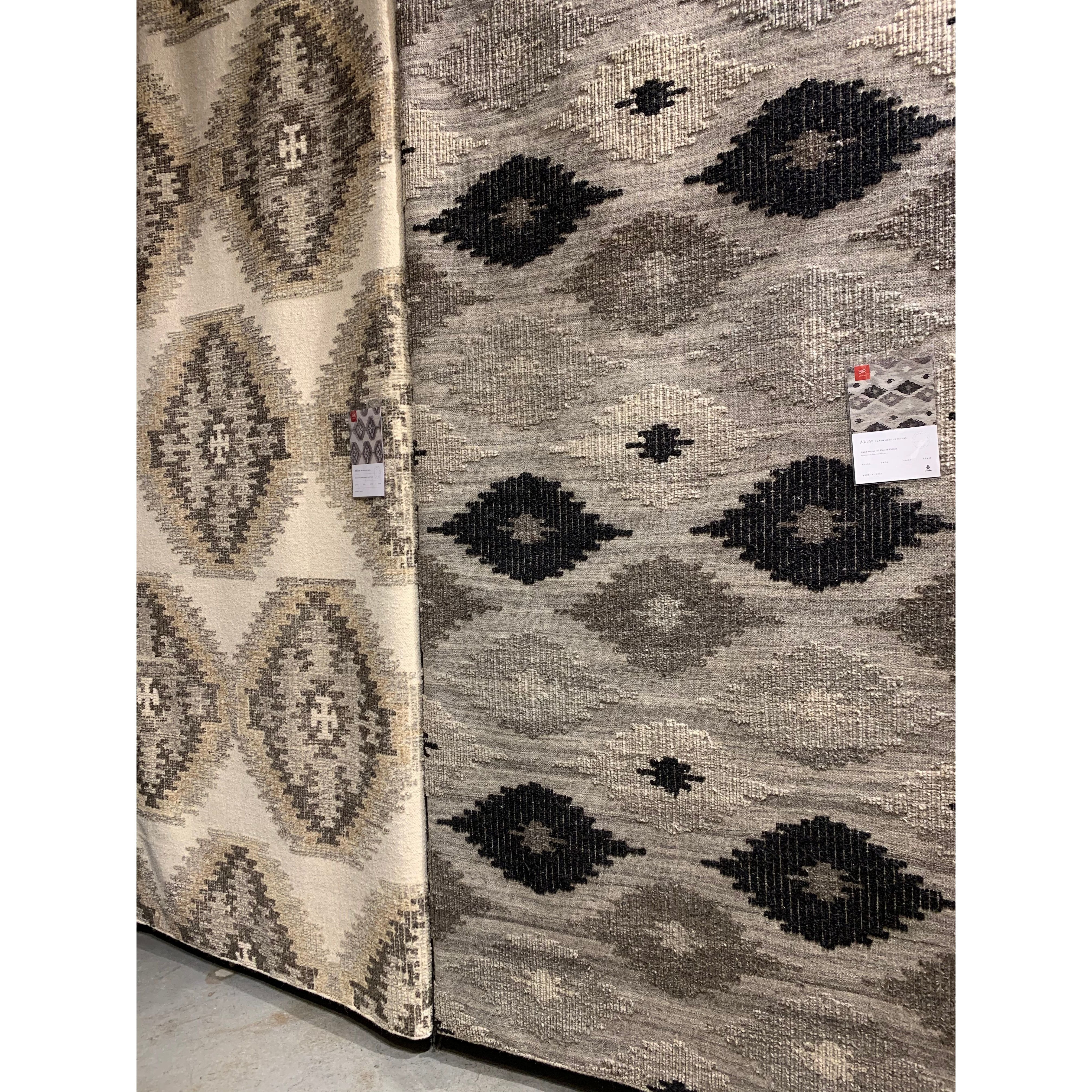 Featuring Akina Grey/Charcoal Rug by Loloi at Amethyst Home. Hand woven in India, the Akina Grey/Charcoal rug sets a rugged and worldly foundation. Each piece is deliberately crafted with textural highs and lows, accentuating the all-over geometric pattern. And because Akina is woven of 100% wool, each piece is naturally durable and fitting for your most.  Amethyst Home provides interior design, new home construction design consulting, vintage area rugs, and lighting in the Kansas City metro area.
