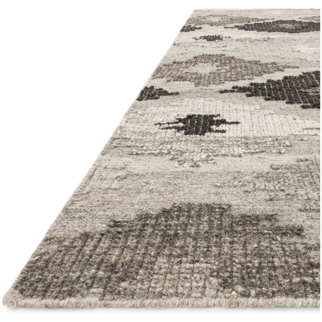 Featuring Akina Grey/Charcoal Rug by Loloi at Amethyst Home. Hand woven in India, the Akina Grey/Charcoal rug sets a rugged and worldly foundation. Each piece is deliberately crafted with textural highs and lows, accentuating the all-over geometric pattern. And because Akina is woven of 100% wool, each piece is naturally durable and fitting for your most high.  Amethyst Home provides interior design, new home construction design consulting, vintage area rugs, and lighting in the Dallas metro area.