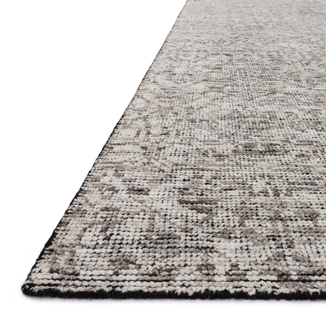Featuring Amara Ivory/Taupe Hand-Knotted Rug by Loloi at Amethyst Home. Hand-knotted in India of 100% wool, the Amara Ivory/Taupe Area Rug creates a casual yet refined vibe with high-end appeal. With shades of ivory, taupe, and black, this is a gorgeous rug to showcase in your living room, entryway, bedroom, or other high traffic area.
Hand Knotted100% Wo.  Amethyst Home provides interior design, new home construction design consulting, vintage area rugs, and lighting in the Des Moines metro area.