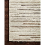 Featuring Bennett Ivory / Pebble Hand-Knotted Rug by Loloi at Amethyst Home. Dimensional yet soft, the Bennett Ivory / Pebble Area Rug is hand-knotted of wool, viscose and polyester in India. Featuring a new carve like high-low pile, Bennett has an ivory base with abstract tonal designs. Plus, it's plush underfoot-- a great choice for your office, bedroom.  Amethyst Home provides interior design, new home construction design consulting, vintage area rugs, and lighting in the Washington metro area.