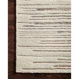 Featuring Bennett Ivory / Pebble Hand-Knotted Rug by Loloi at Amethyst Home. Dimensional yet soft, the Bennett Ivory / Pebble Area Rug is hand-knotted of wool, viscose and polyester in India. Featuring a new carve like high-low pile, Bennett has an ivory base with abstract tonal designs. Plus, it's plush underfoot-- a great choice for your office, bedroom.  Amethyst Home provides interior design, new home construction design consulting, vintage area rugs, and lighting in the Washington metro area.