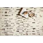 Featuring Bennett Ivory / Forest Hand-Knotted Rug by Loloi at Amethyst Home. Dimensional yet soft, the Bennett Ivory / Forest Area Rug is hand-knotted of wool, viscose and polyester in India. Featuring a new carve like high-low pile, Bennett has an ivory base with abstract tonal designs. Plus, it's plush underfoot-- a great choice for your office, bedroom, .  Amethyst Home provides interior design, new home construction design consulting, vintage area rugs, and lighting in the Portland metro area.