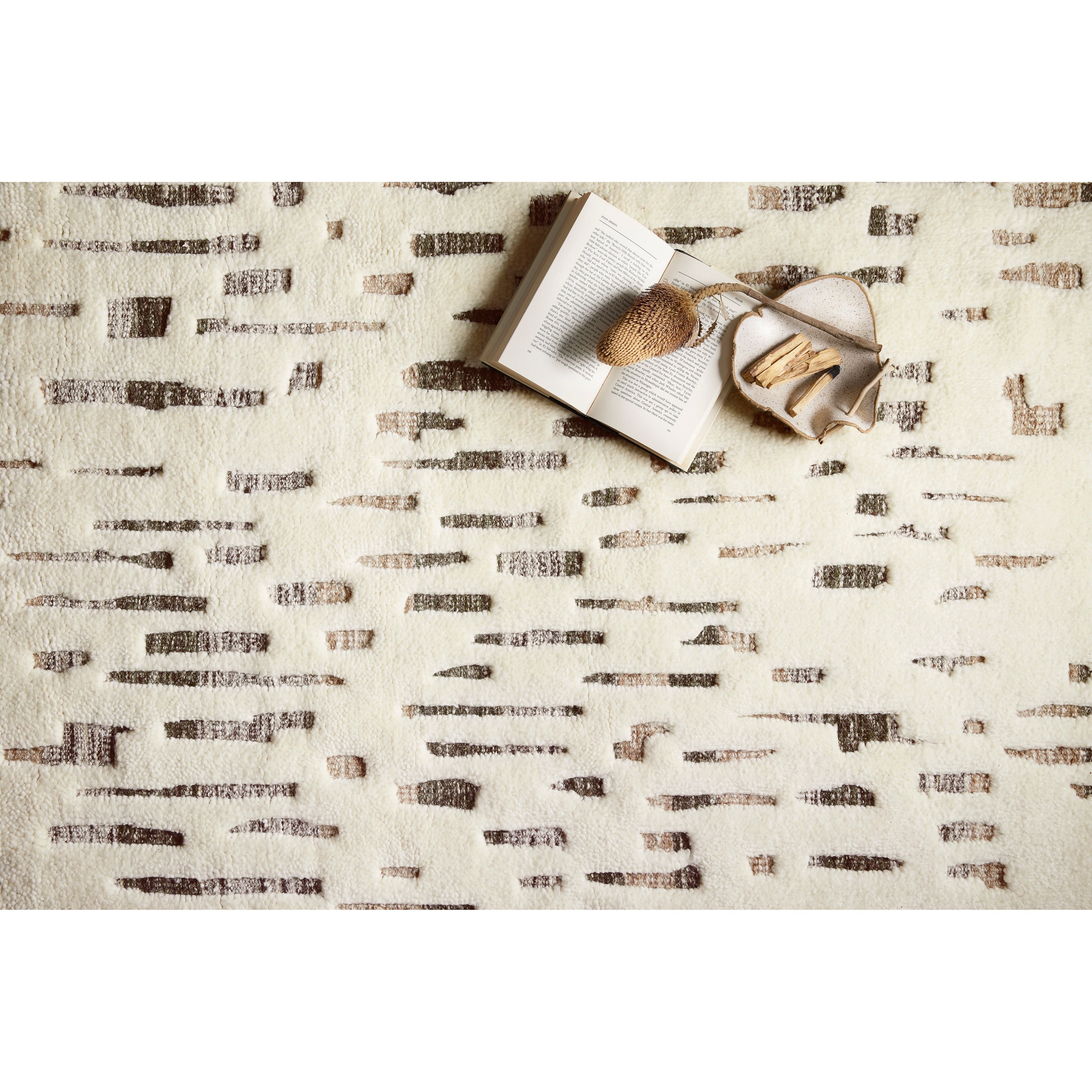 Featuring Bennett Ivory / Forest Hand-Knotted Rug by Loloi at Amethyst Home. Dimensional yet soft, the Bennett Ivory / Forest Area Rug is hand-knotted of wool, viscose and polyester in India. Featuring a new carve like high-low pile, Bennett has an ivory base with abstract tonal designs. Plus, it's plush underfoot-- a great choice for your office, bedroom, .  Amethyst Home provides interior design, new home construction design consulting, vintage area rugs, and lighting in the Portland metro area.