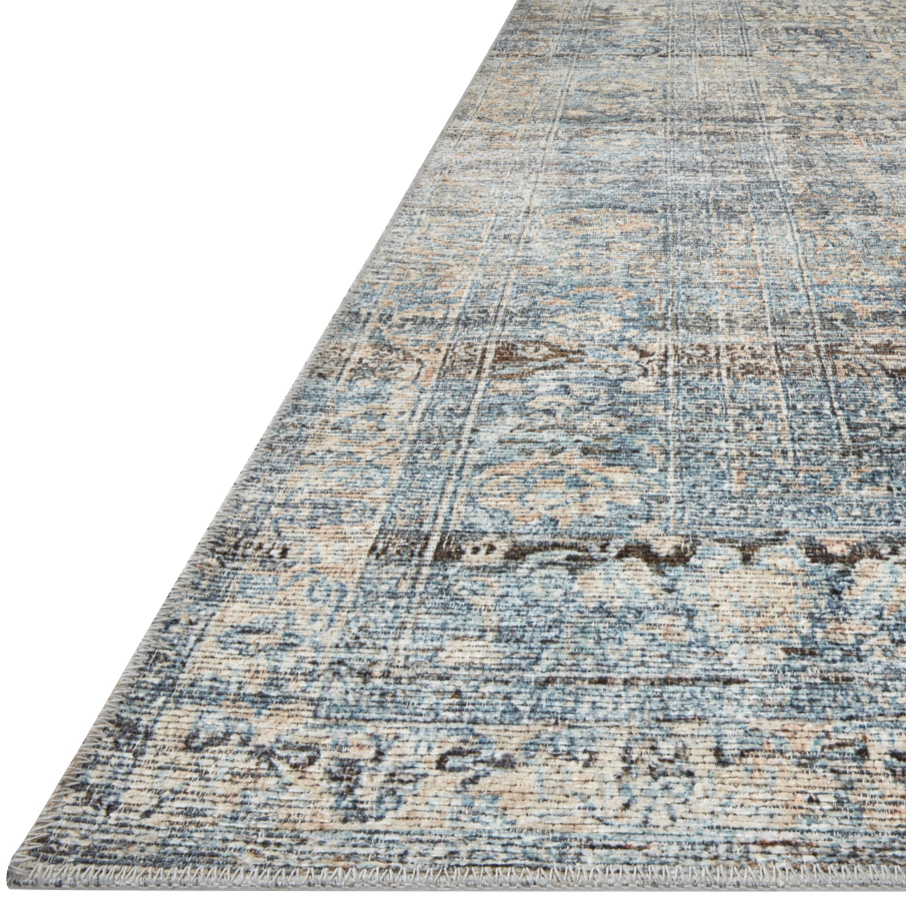 Featuring Billie Amber Lewis x Loloi Denim / Blush Rug by Loloi at Amethyst Home. Touting richly saturated colors and a distressed pattern, the Billie Collection captures the look of a well-worn antique rug at a remarkable value. Reminiscent of one-of-a-kind rugs, this Amber Lewis x Loloi collection features random variations in color that render no two pi.  Amethyst Home provides interior design, new home construction design consulting, vintage area rugs, and lighting in the Nashville metro area.