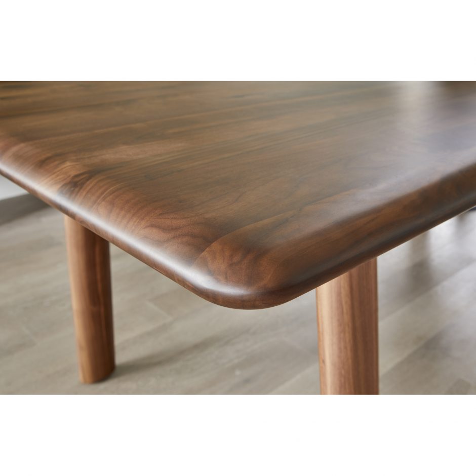 The Malibu dining table embodies an organic aesthetic through its design. Thick pieces of solid walnut is used from head to toe, showing off this pieces beautiful grain pattern and shades. The rounded edges on the legs and table-top creates a flow that is more contemporary and natural. With seating space for 10, the Malibu dining table can host the entire neighborhood.   Dimensions: 88"W x 38"D x 30"H  Materials: Solid Walnut