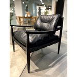 This Turner Leather Chair is a boldly blocked silhouette with swooped armrests, buttery soft top-grain leather, and solid ash wooden frame. The button-tufted cushion supports a gentle half-back, and a bonded leather support weave softens a wider seat underneath the feather + foam-filled cushion -- a comfy accent chair to add to any living room or office!  Size: 28.5"W x 30"D x 30"H