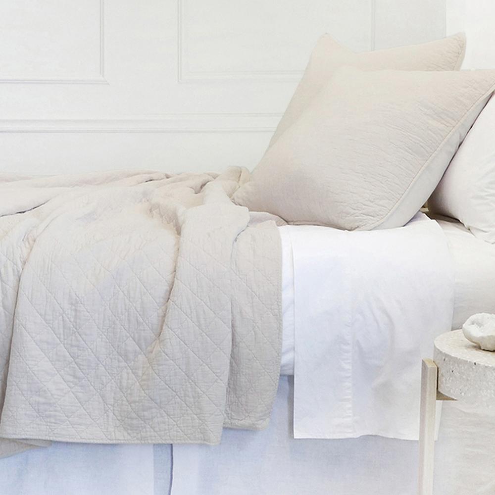This versatile collection is made of 100% stone washed cotton that offers year-round comfort and luxury. The Huntington Coverlet Bedding Taupe by Pom Pom at Home features a diamond quilted pattern and 1/2" piping along the edges. 100% Cotton Machine wash cold; tumble dry low; warm iron as needed. Do not bleach