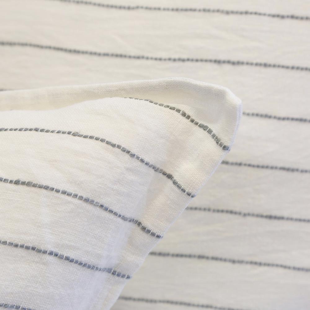 This Blake Duvet Collection Cream/Gray is youthful and casual with subtle frayed edges. Made of 100% linen, the duvet cover and shams are finished with simple tie closures. Inserts sold separately 100% linen Shell-button closure Machine wash cold; tumble dry low; warm iron as needed. Do not bleach