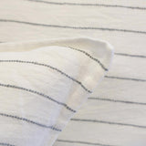 This Blake Duvet Collection Cream/Gray is youthful and casual with subtle frayed edges. Made of 100% linen, the duvet cover and shams are finished with simple tie closures. Inserts sold separately 100% linen Shell-button closure Machine wash cold; tumble dry low; warm iron as needed. Do not bleach