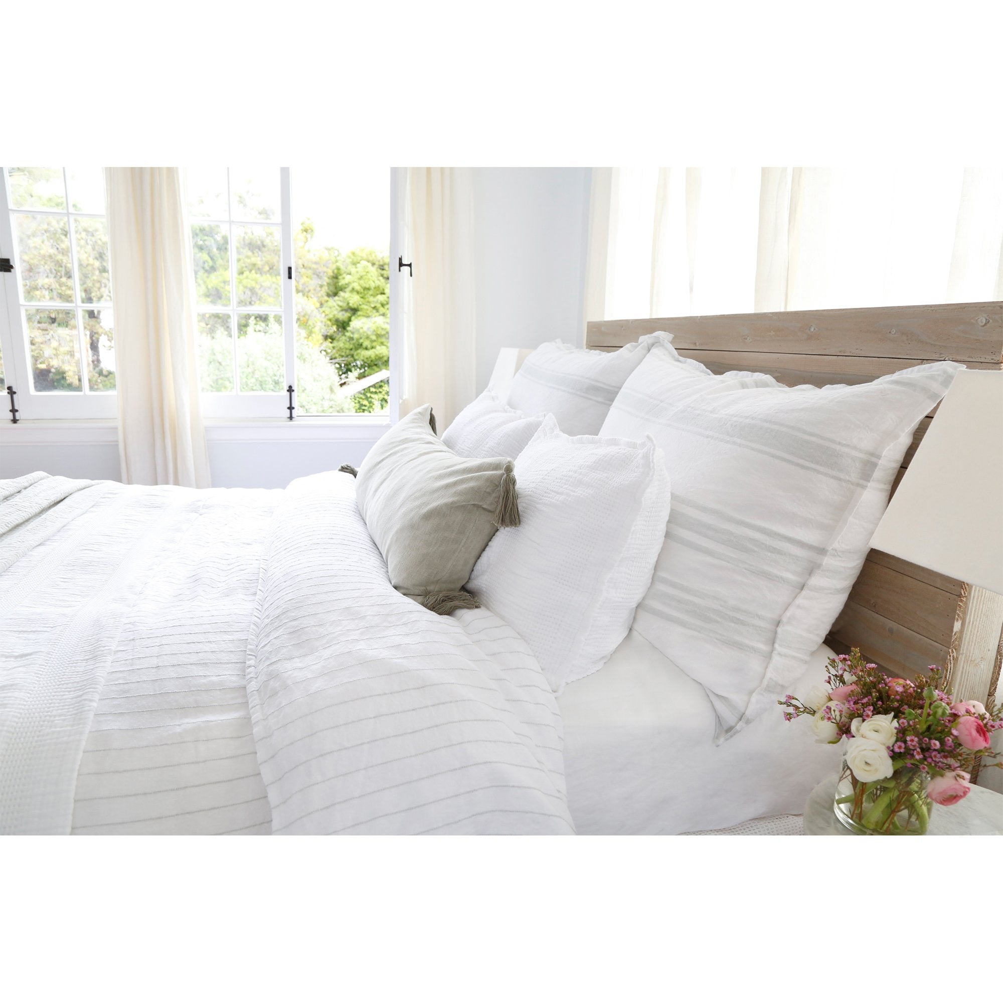 The Blake Duvet Collection White/Ocean by Pom Pom at Home features an interwoven stripe texture, giving a modern refresh to a traditional stripe. Our duvet and shams are hand-loomed by artisans and the linen is washed for a relaxed lived-in look for any bedroom. Inserts sold separately 100% linen Shell-button closure Machine wash cold; tumble dry low; warm iron as needed. Do not bleach