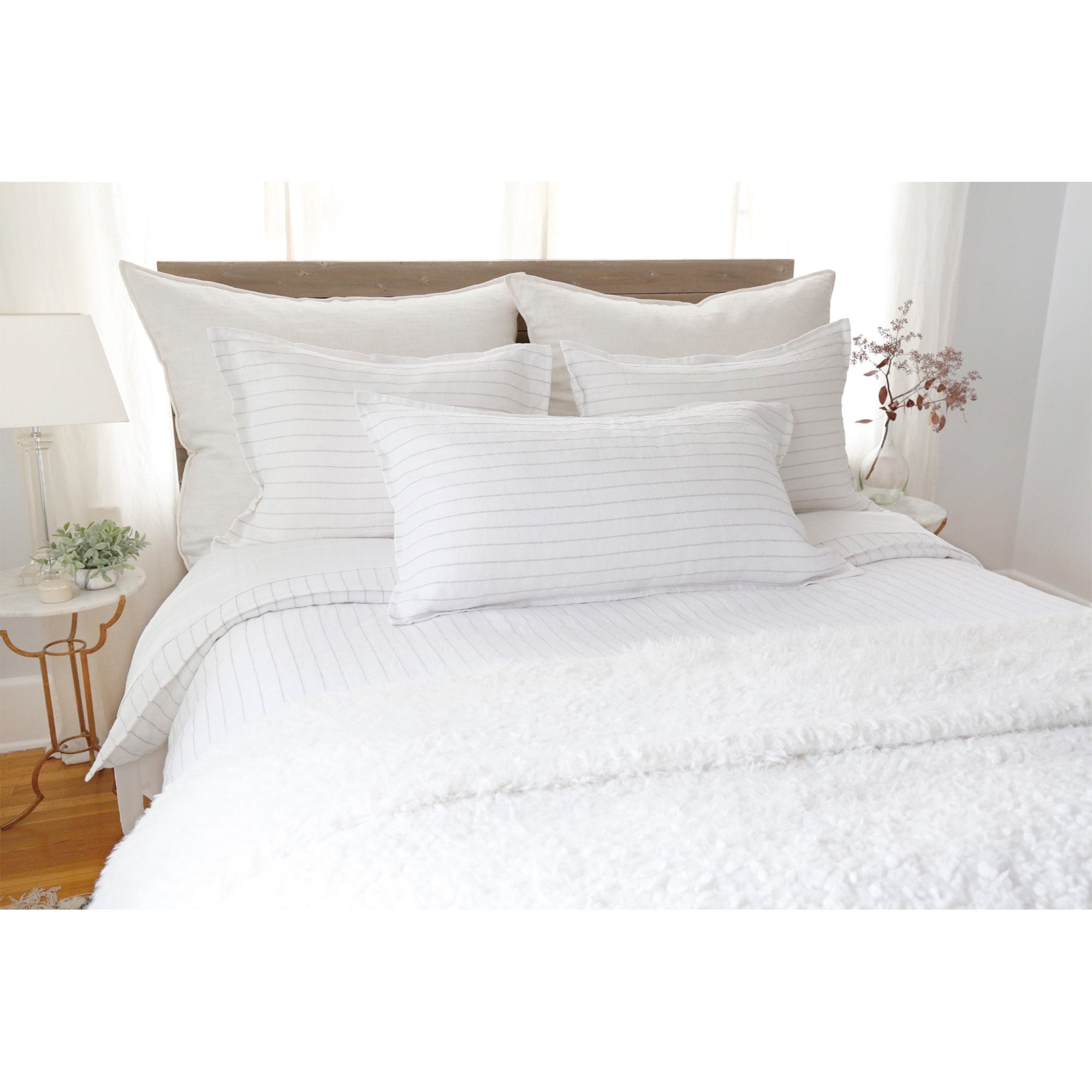 The Blake Duvet Collection White/Ocean by Pom Pom at Home features an interwoven stripe texture, giving a modern refresh to a traditional stripe. Our duvet and shams are hand-loomed by artisans and the linen is washed for a relaxed lived-in look for any bedroom. Inserts sold separately 100% linen Shell-button closure Machine wash cold; tumble dry low; warm iron as needed. Do not bleach