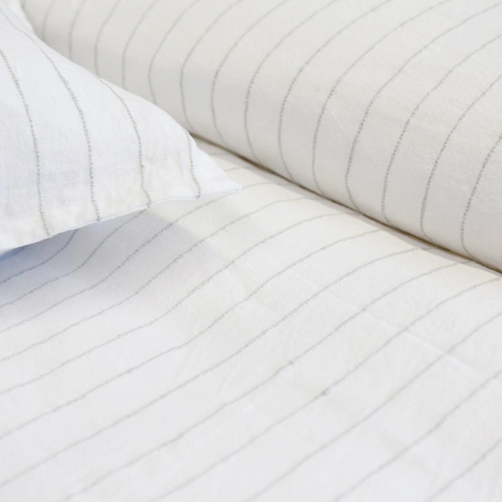 The Blake Duvet Collection White/Ocean by Pom Pom at Home features an interwoven stripe texture, giving a modern refresh to a traditional stripe. Our duvet and shams are hand-loomed by artisans and the linen is washed for a relaxed lived-in look for any bedroom. Inserts sold separately 100% linen Shell-button closure Machine wash cold; tumble dry low; warm iron as needed. Do not bleach