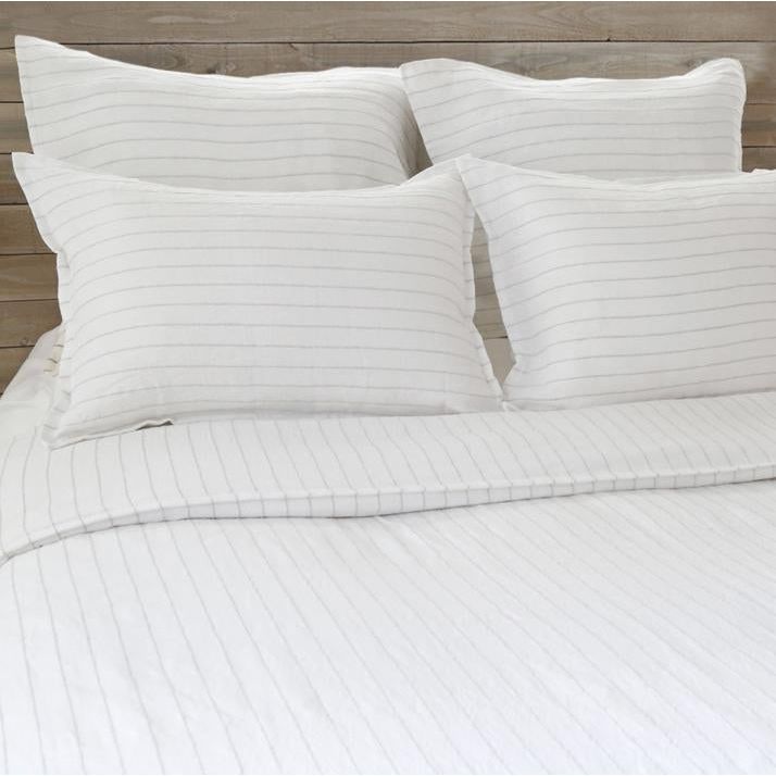 The Blake Duvet Collection White/Ocean by Pom Pom at Home features an interwoven stripe texture, giving a modern refresh to a traditional stripe. Our duvet and shams are hand-loomed by artisans and the linen is washed for a relaxed lived-in look for any bedroom. Inserts sold separately 100% linen Shell-button closure Machine wash cold; tumble dry low; warm iron as needed. Do not bleach