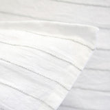 The Blake Duvet Collection White/Ocean by Pom Pom at Home features an interwoven stripe texture, giving a modern refresh to a traditional stripe. Our duvet and shams are hand-loomed by artisans and the linen is washed for a relaxed lived-in look for any bedroom.    Inserts sold separately 100% linen Shell-button closure Machine wash cold; tumble dry low; warm iron as needed. Do not bleach