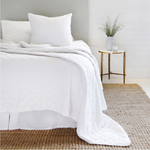 The Brussels Coverlet Bedding White by Pom Pom at Home is a grand and sophisticated line that has a diamond quilted pattern on the front, made of 100% stone washed cotton velvet. Available in several soft, stone washed colors.  100% cotton velvet Machine wash cold; tumble dry low; warm iron as needed Do not bleach