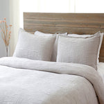 Crafted in Portugal, the Harbour Matelasse Collection Taupe by Pom Pom at Home features an abstract, geometric weave making it a modern matelasse. The matelasse achieves a beautiful texture without any batting. 100% cotton.  100% cotton. Machine wash cold; tumble dry low; warm iron as needed Do not bleach