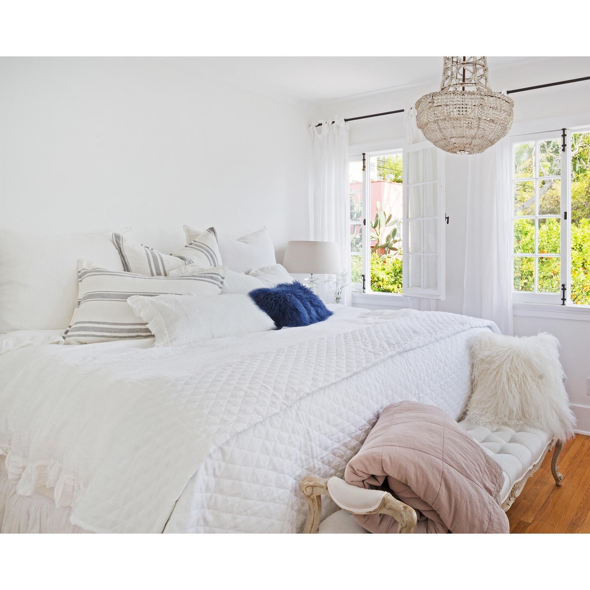 A timeless classic, the Hampton Coverlet Collection White through Pom Pom at Home is a luxurious diamond quilted coverlet made of washed linen. It is finished with a 1/2" flange and straight corners. Details & Care: 100% linen Machine wash cold; tumble dry low; warm iron as needed. Do not bleach