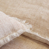 Subtle frayed edges of soft linen add a dash of unexpected detail to this Logan Duvet Collection Terra Cotta by Pom Pom at Home. Woven with two different colored yarns for a heathered effect, the duvet cover and shams feature shell button closures.  Inserts sold separately 100% linen Shell-button closure Machine wash cold; tumble dry low; warm iron as needed. Do not bleach