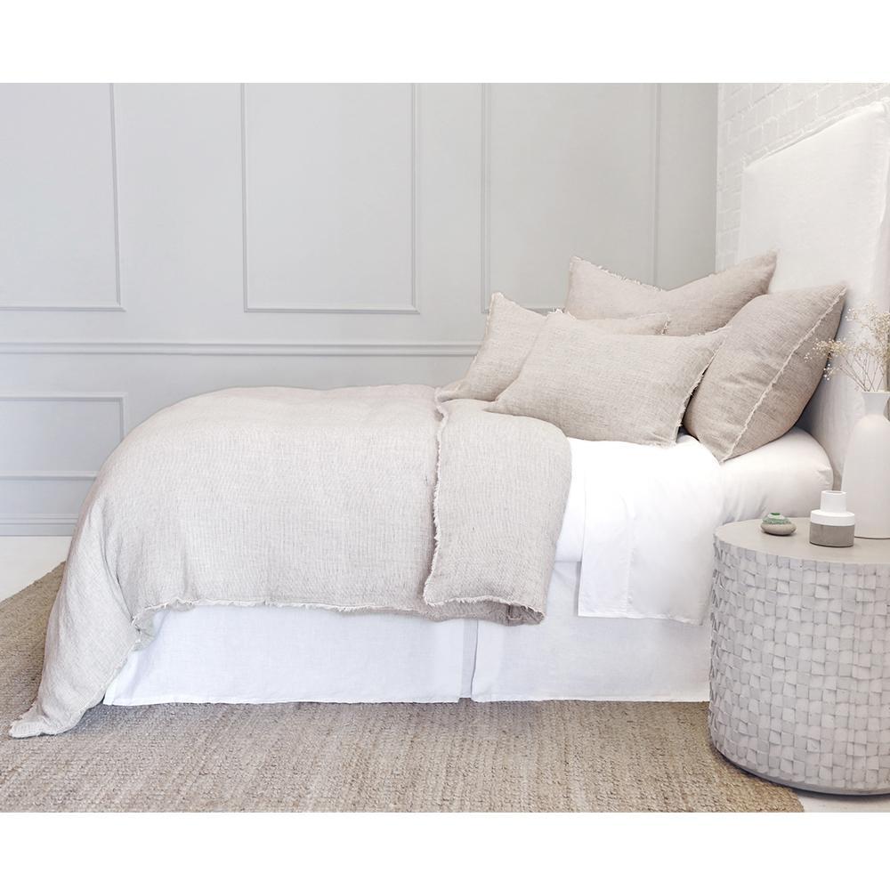 Subtle frayed edges of soft linen add a dash of unexpected detail to this Logan Duvet Collection Terra Cotta by Pom Pom at Home. Woven with two different colored yarns for a heathered effect, the duvet cover and shams feature shell button closures. Inserts sold separately 100% linen Shell-button closure Machine wash cold; tumble dry low; warm iron as needed. Do not bleach