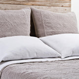The Marseille Coverlet Bedding Taupe by Pom Pom at Home is luxurious and elegant with a detailed floral and diamond quilted pattern on the front made of 100% stone washed cotton velvet. 100% cotton velvet Machine wash cold; tumble dry low; warm iron as needed Do not bleach