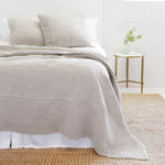 The Marseille Coverlet Bedding Taupe by Pom Pom at Home is luxurious and elegant with a detailed floral and diamond quilted pattern on the front made of 100% stone washed cotton velvet.  100% cotton velvet Machine wash cold; tumble dry low; warm iron as needed Do not bleach