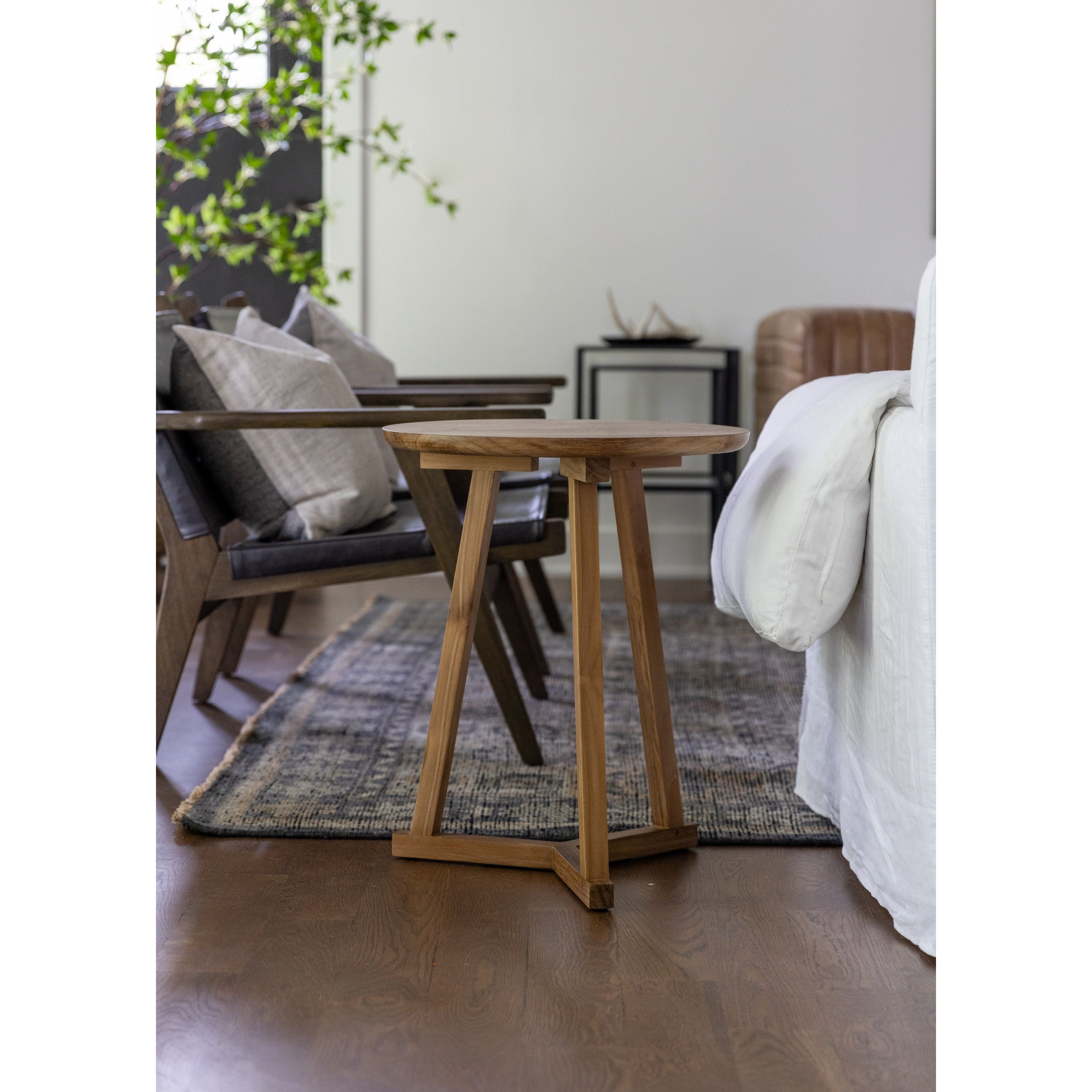 Featuring Teak Tripod Side Table by Ethnicraft at Amethyst Home. We love the versatility of this Teak Tripod Side Table. This can be placed next to a sofa, used as a bedside table, or grouped together with multiple tables for an interesting look!
Dimensions: 18.5"w x 18.5"d x 22.5"h 
Material: Teak Finish: Oiled
For regular dusting use a dry cloth. For c.  Amethyst Home provides interior design, new home construction design consulting, vintage area rugs, and lighting in the Los Angeles metro area.