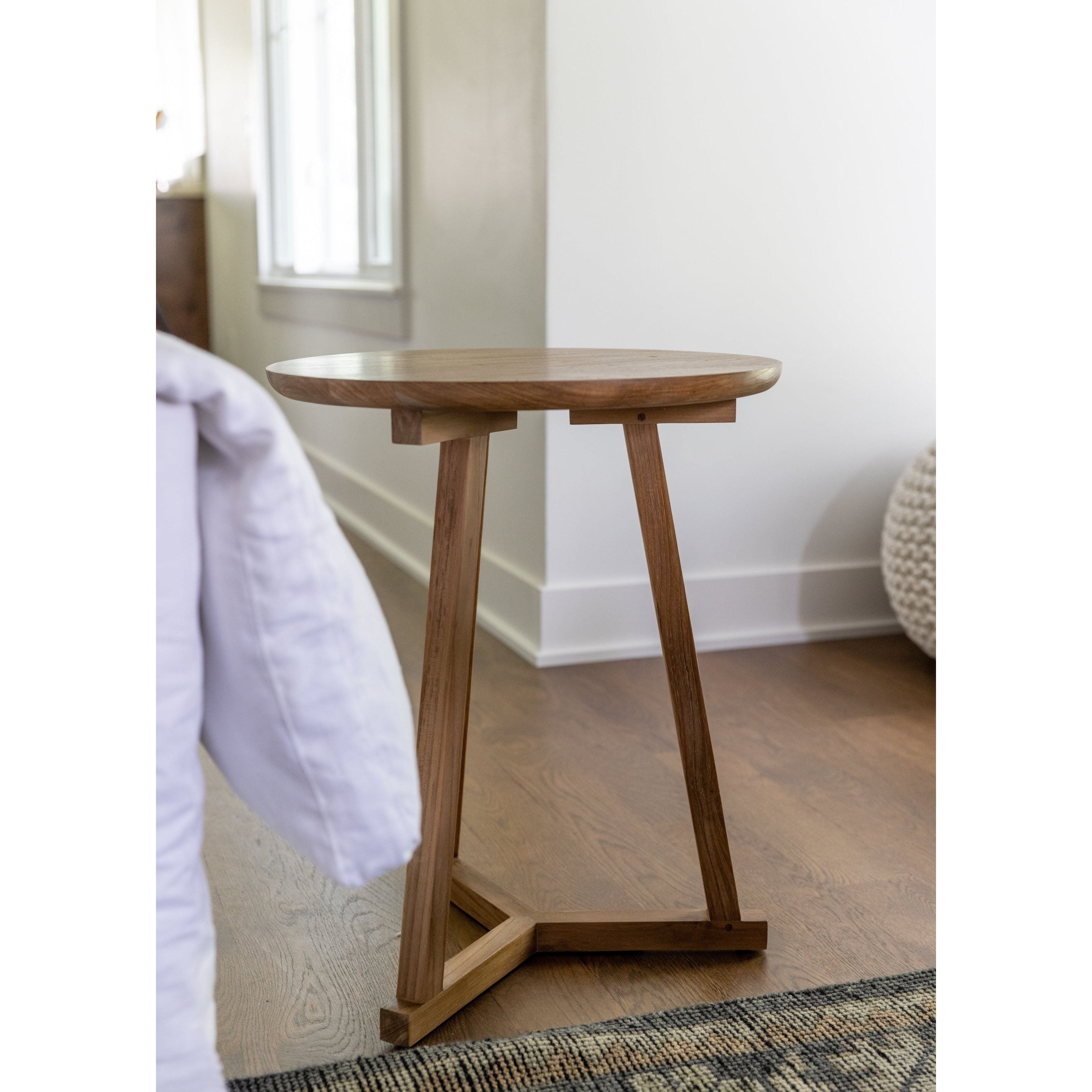Featuring Teak Tripod Side Table by Ethnicraft at Amethyst Home. We love the versatility of this Teak Tripod Side Table. This can be placed next to a sofa, used as a bedside table, or grouped together with multiple tables for an interesting look!
Dimensions: 18.5"w x 18.5"d x 22.5"h 
Material: Teak Finish: Oiled
For regular dusting use a dry cloth. For.  Amethyst Home provides interior design, new home construction design consulting, vintage area rugs, and lighting in the Newport Beach metro area.