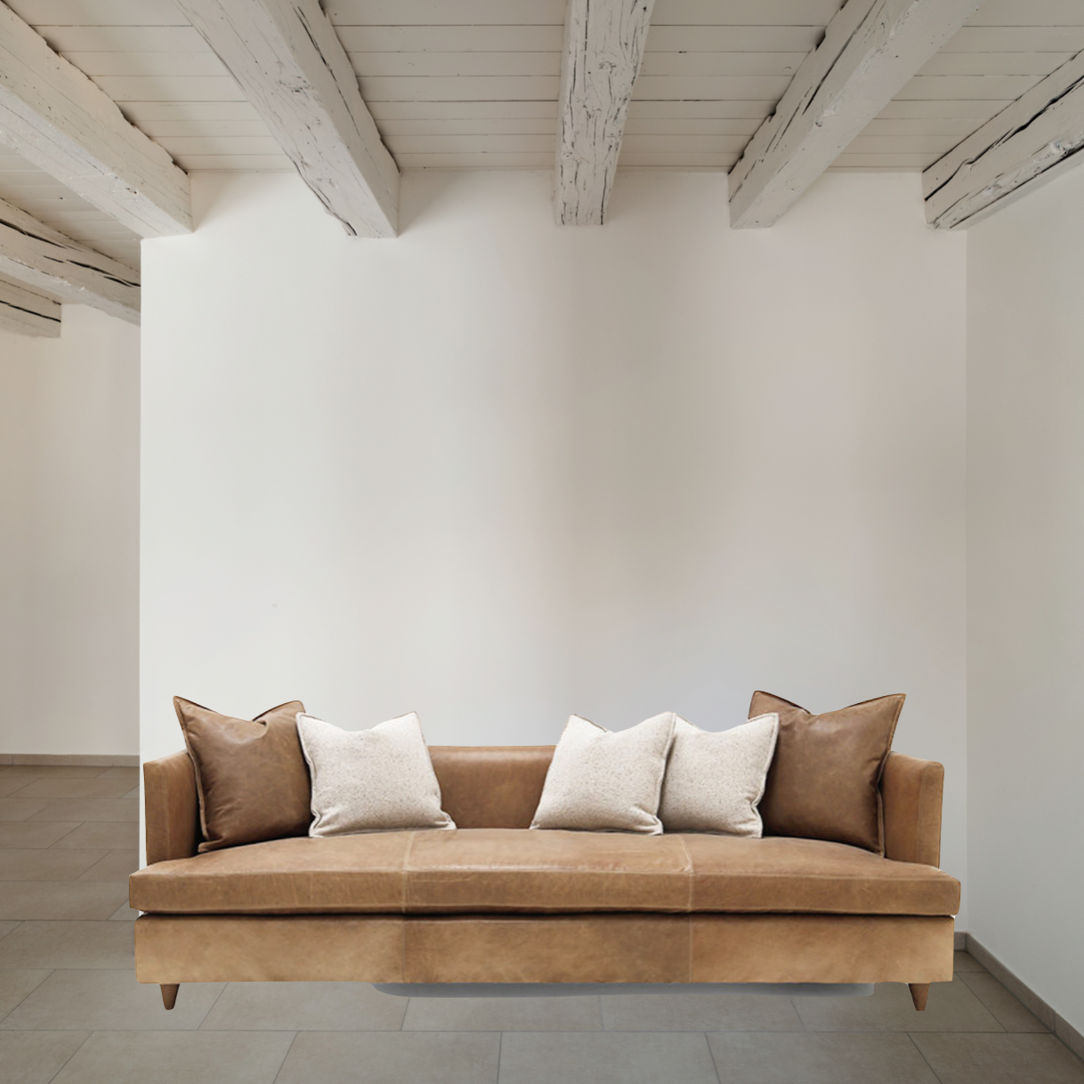 Verellen's Marilyn Sofa Family is bench-crafted in their North Carolina atelier, and features:  foam down seat construction loose boxed style seat cushion diamond tufted inside back with fabric covered ball buttons optional without tufting large and small knife edge toss pillows double needle stitch detail 4″ H conical leg