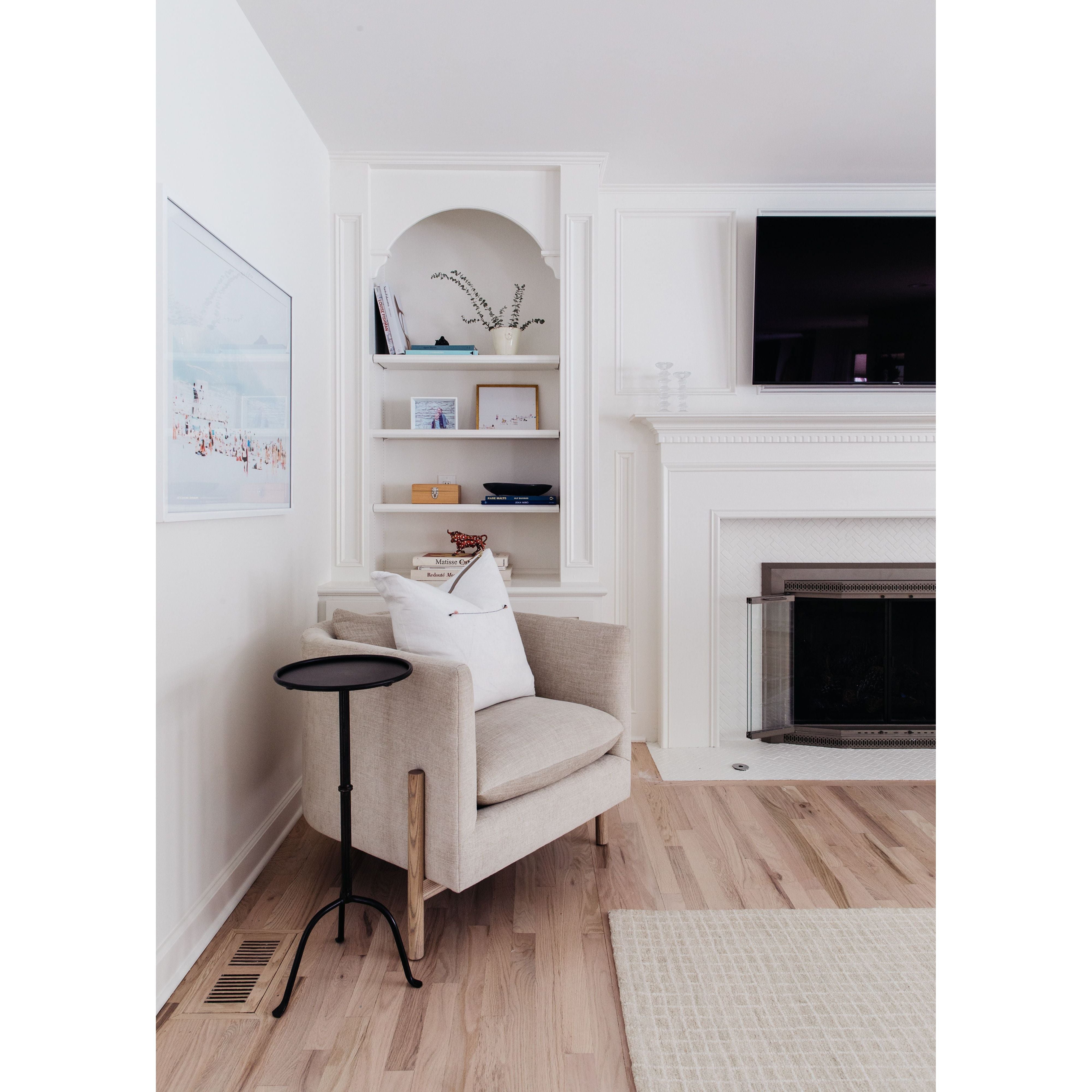 A piece we lovingly refer to as the "three legged-dog" to our clients, the Sullivan chair from Verellen is a beautiful statement piece from every angle. The 360 degree attention to detail makes it a striking piece in open concept spaces. This chair sits wonderfully for mounted televisions or with conversation and a glass of wine in the evening.  Select from Ash wood or Walnut legs.  33”w X 34”d x 28”/30”h