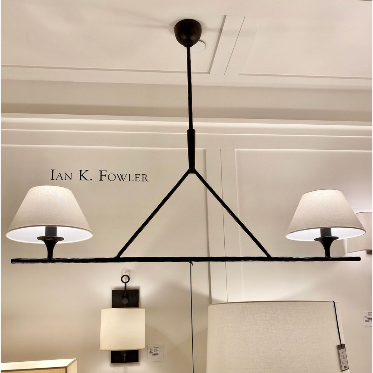 Featuring Cesta Linear Chandelier by Visual Comfort at Amethyst Home. The Cesta Linear Chandelier by Visual Comfort is finished in aged iron with a linen shade. We love the timeless look it brings to a living room, dining room, or other large area. 
Overall Dimensions: 54" L x 54" W x 57.5" HWeight: 24 lbs.  Amethyst Home provides interior design, new home construction design consulting, vintage area rugs, and lighting in the Alpharetta metro area.