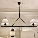 Featuring Cesta Linear Chandelier by Visual Comfort at Amethyst Home. The Cesta Linear Chandelier by Visual Comfort is finished in aged iron with a linen shade. We love the timeless look it brings to a living room, dining room, or other large area. 
Overall Dimensions: 54" L x 54" W x 57.5" HWeight: 24 lbs.  Amethyst Home provides interior design, new home construction design consulting, vintage area rugs, and lighting in the Alpharetta metro area.