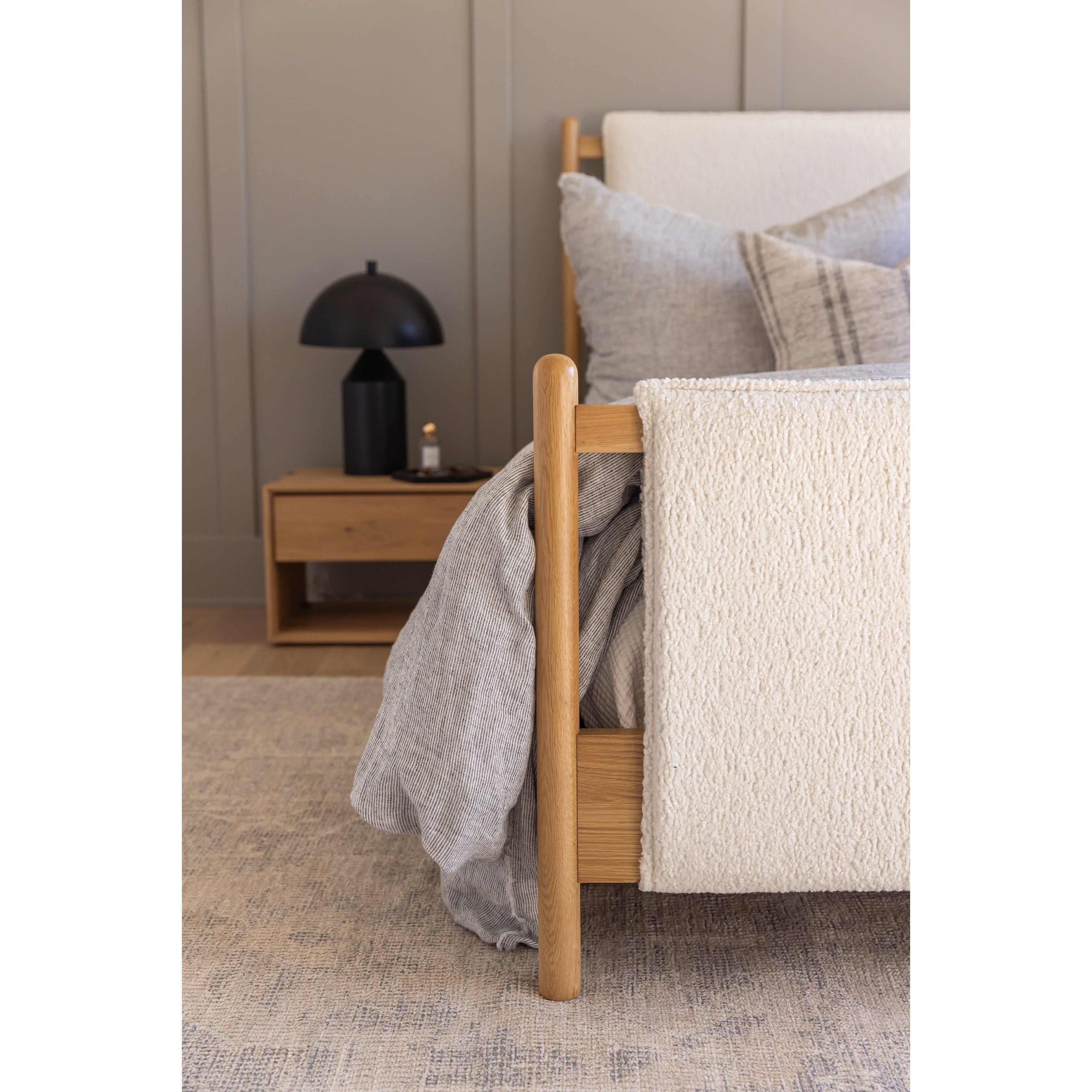 Bring a cozy hygge vibe to the bedroom with this textured Bowen Bed. Framed by light-finished solid oak, a sling-style bed features faux shearling head and foot boards -- sure to elevate any bedroom. Amethyst Home provides interior design, new home construction design consulting, vintage area rugs, and lighting in the Miami metro area.