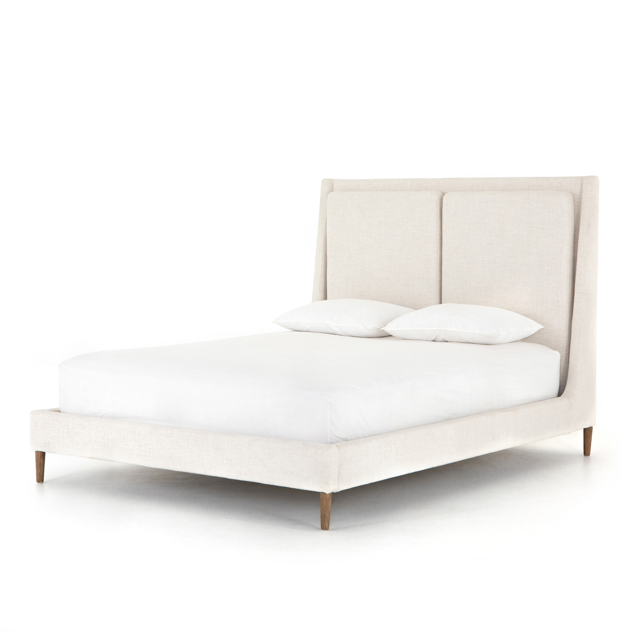 Welcome light, livable luxury into your bedroom with a fully upholstered bed. A tapered headboard features a fixed oversized cushion of high-performance fabric, creating a soft, layered look. Understated wooden legs complete the design. Amethyst Home provides interior design, new home construction design consulting, vintage area rugs, and lighting in the Nashville metro area.