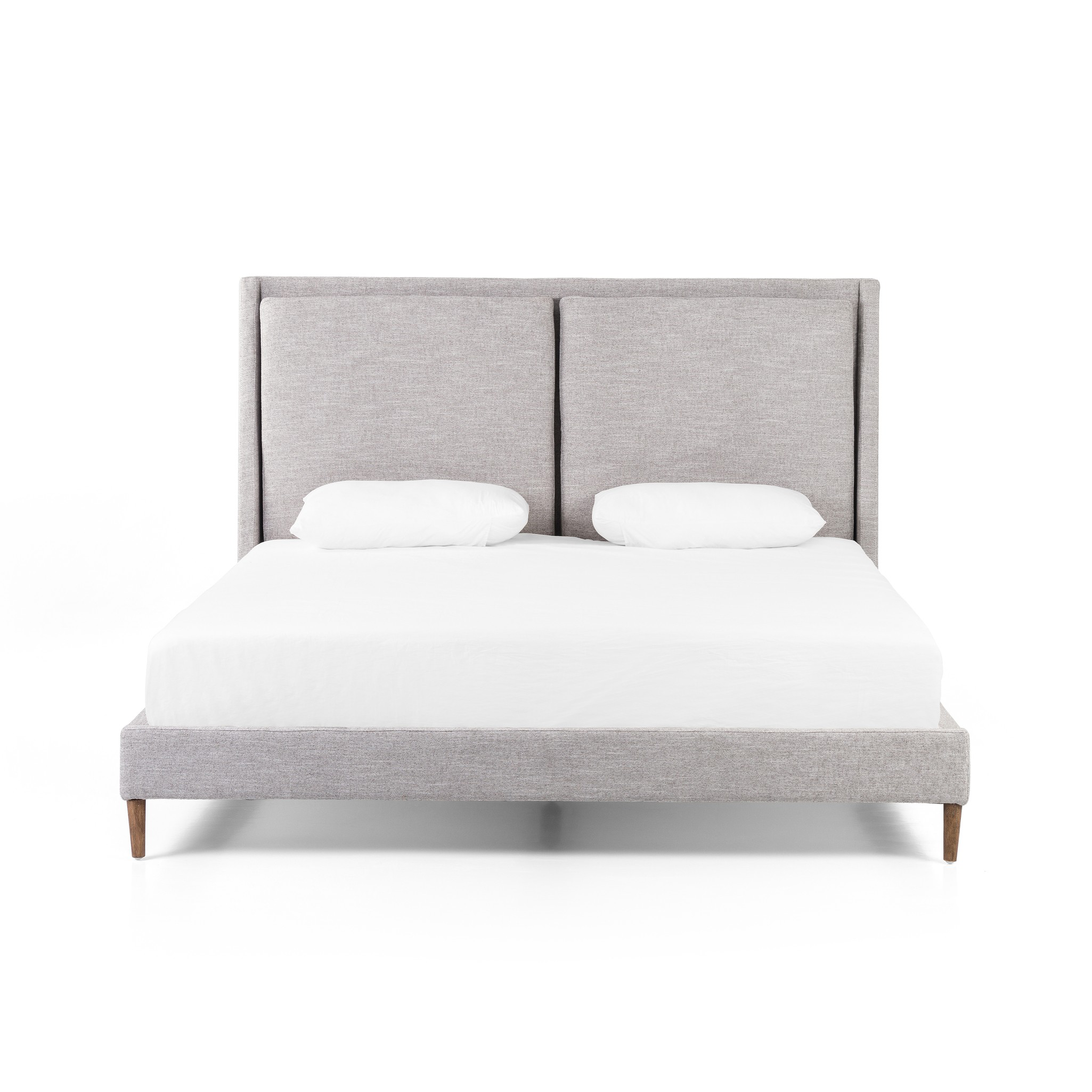 Featuring Potter Manor Grey Bed by Four Hands at Amethyst Home. Light, livable luxury. Upholstered in a grey synthetic-blend, a tapered headboard features fixed overscale pillows, for a calming look with great depth. Wire-brushed parawood legs lend a warm, natural finishing touch. Performance fabrics are specially created to withstand spills, stains, high t. Amethyst Home provides interior design, new home construction design consulting, vintage area rugs, and lighting in the Charlotte metro area.