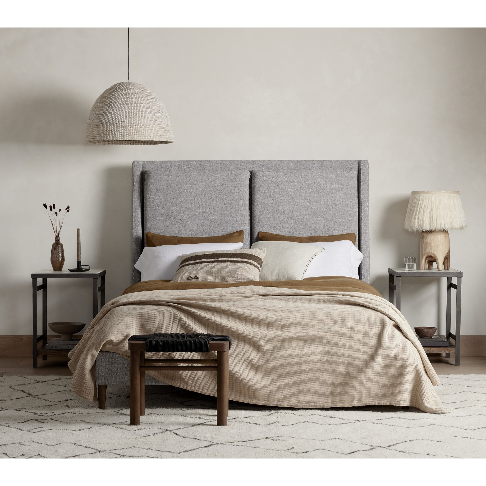 Featuring Potter Manor Grey Bed by Four Hands at Amethyst Home. Light, livable luxury. Upholstered in a grey synthetic-blend, a tapered headboard features fixed overscale pillows, for a calming look with great depth. Wire-brushed parawood legs lend a warm, natural finishing touch. Performance fabrics are specially created to withstand spills, stains, high t. Amethyst Home provides interior design, new home construction design consulting, vintage area rugs, and lighting in the Park City metro area.