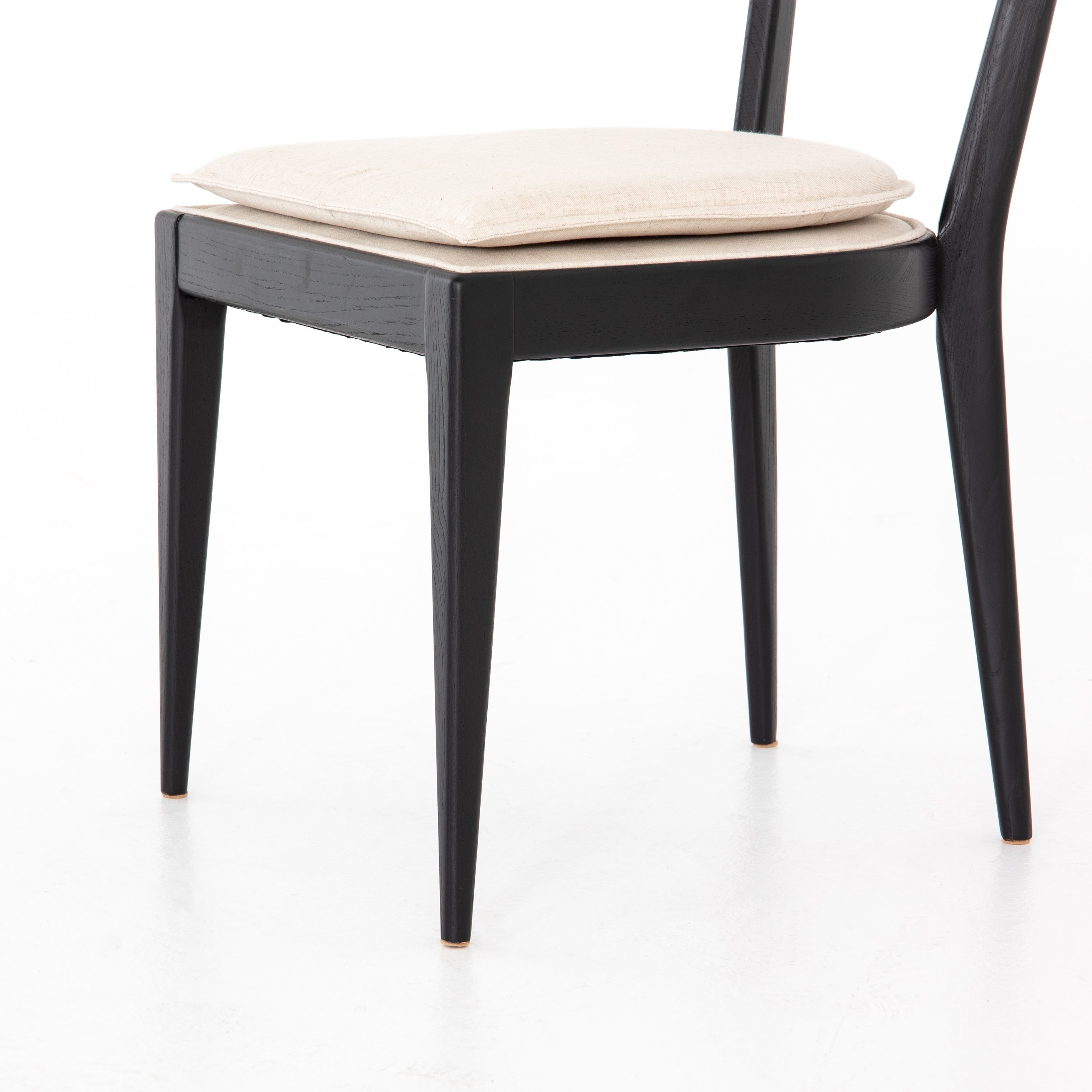 Mixed materials refresh retro dining style. Ebony-finished nettlewood frames a textural inlay of natural cane, for perfect contrast. Fastened by Velcro, high-performance linen-blend seating for modern sensibility. Performance fabrics are specially created to withstand spills, stains, high traffic and wear, ensuring long-term comfort and unmatched durability. Amethyst Home provides interior design, new construction, custom furniture and area rugs in the Atlanta metro area