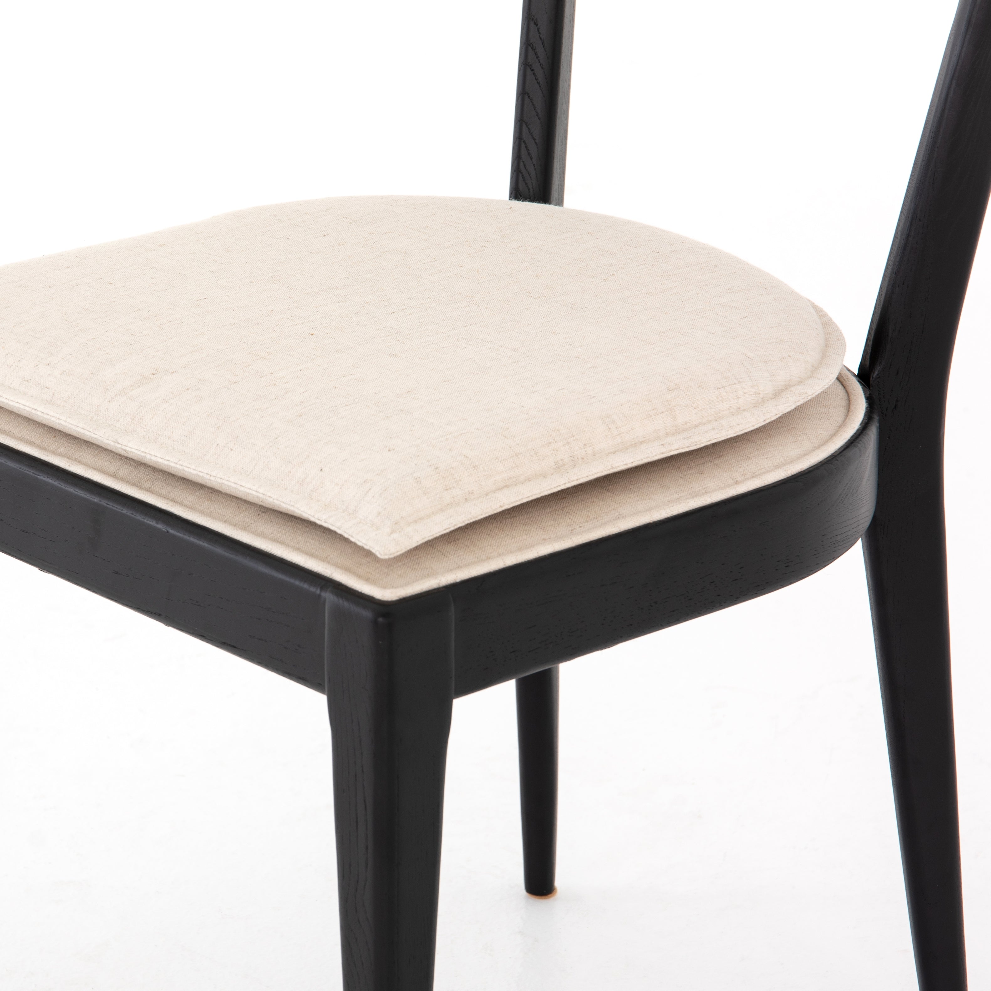 Mixed materials refresh retro dining style. Ebony-finished nettlewood frames a textural inlay of natural cane, for perfect contrast. Fastened by Velcro, high-performance linen-blend seating for modern sensibility. Performance fabrics are specially created to withstand spills, stains, high traffic and wear, ensuring long-term comfort and unmatched durability. Amethyst Home provides interior design, new construction, custom furniture and area rugs in the Nashville metro area