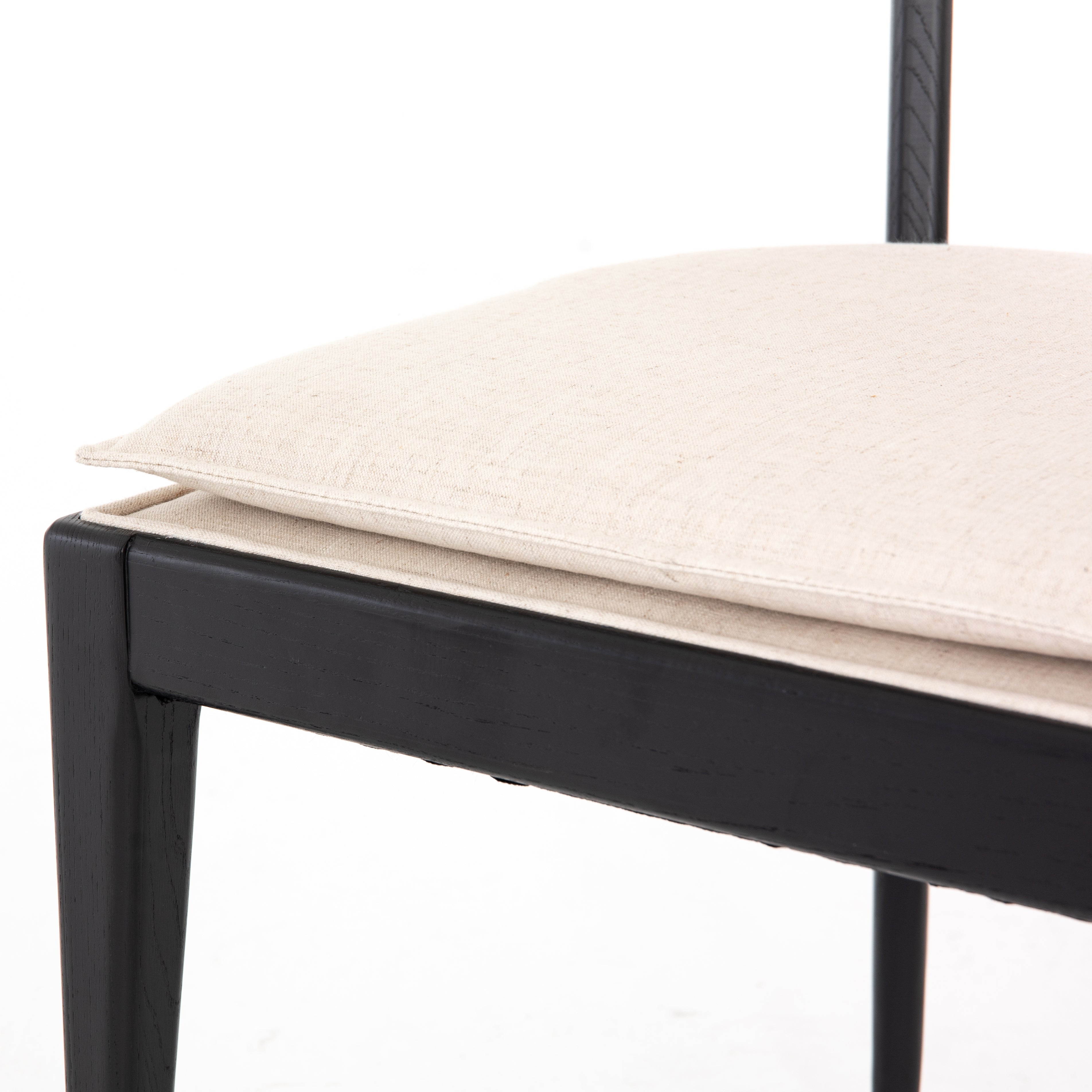 Mixed materials refresh retro dining style. Ebony-finished nettlewood frames a textural inlay of natural cane, for perfect contrast. Fastened by Velcro, high-performance linen-blend seating for modern sensibility. Performance fabrics are specially created to withstand spills, stains, high traffic and wear, ensuring long-term comfort and unmatched durability. Amethyst Home provides interior design, new construction, custom furniture and area rugs in the Chicago metro area